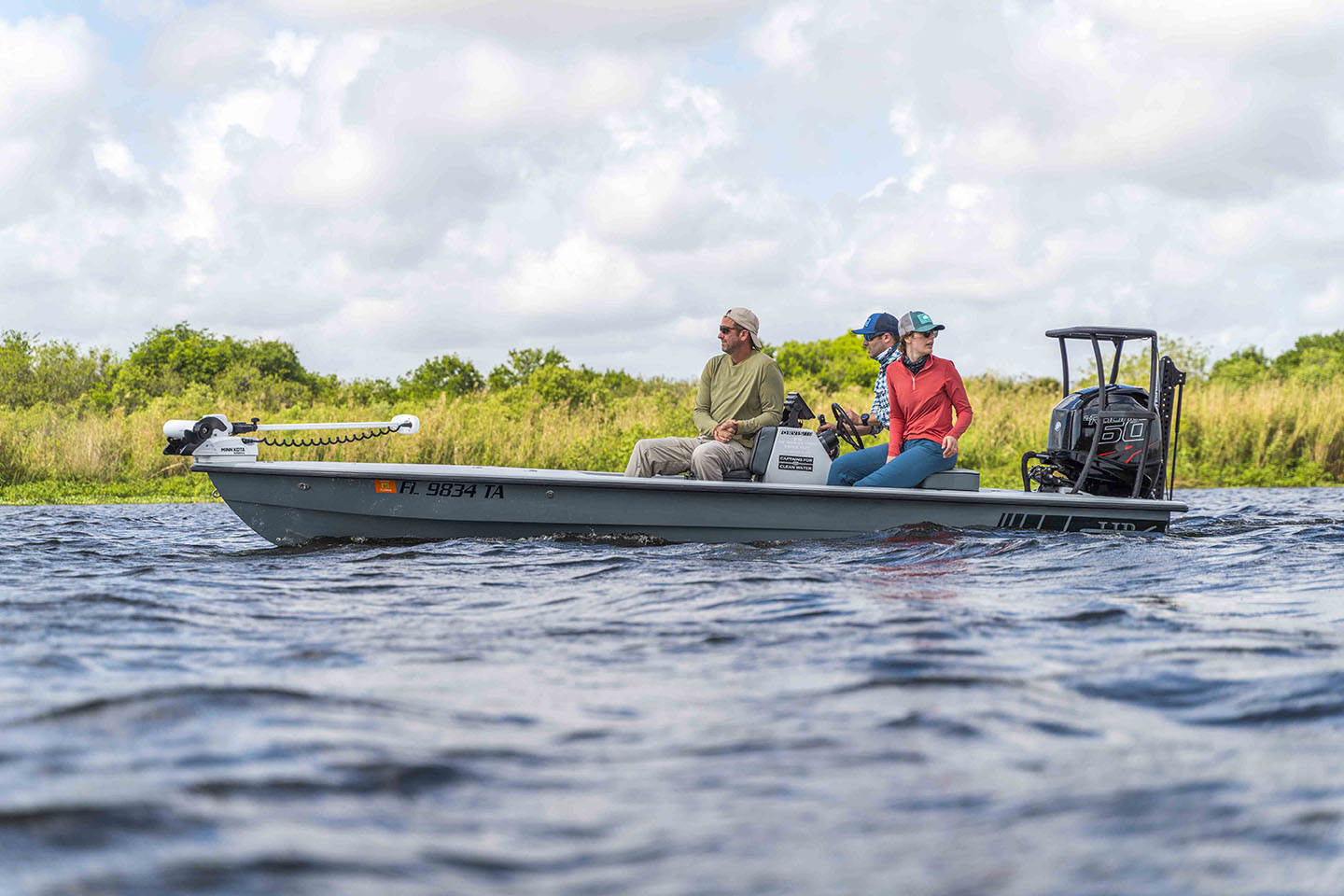 Orvis Employees on a boat for flyfishing