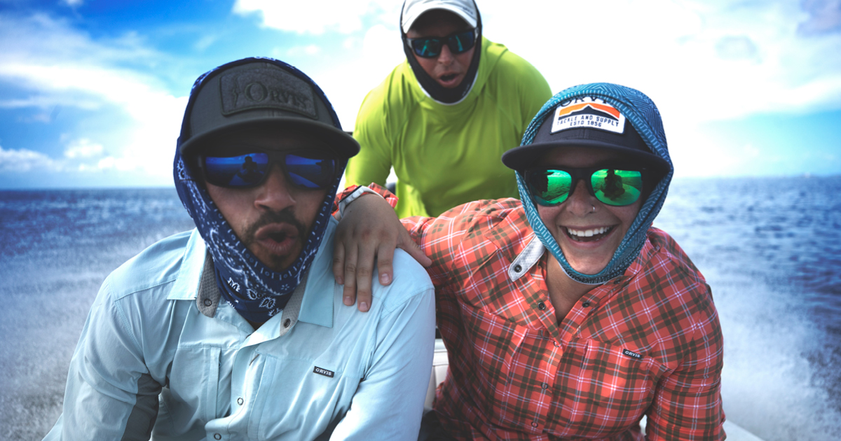 Orvis Employees on a boat in the water